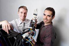 Toronto’s Michal Prywata and Thiago Caires, previous winners of a Dyson Awards, with the new AMO Arm prosthetic device.