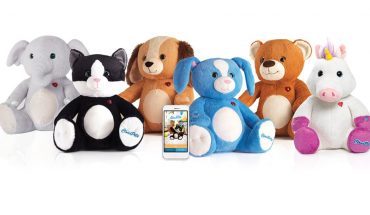 smartphone surrounded by stuffed toys