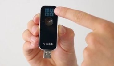 USB dongle held in man's hands