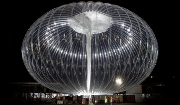 silvery balloon pictured at night