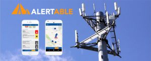 alertable app on iPHone scrren, cell tower in background