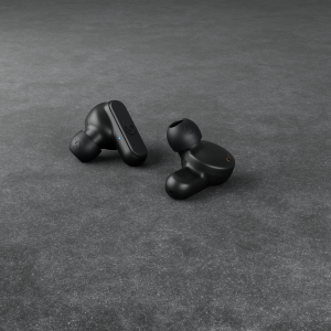 black earbuds on flat surface