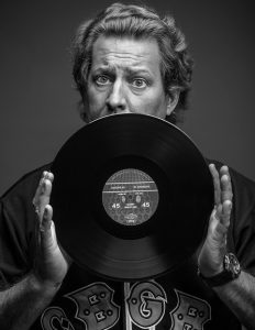 Alan Cross holds up long playing record