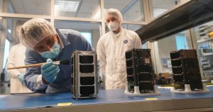 Canadian STEM students in clean lab work on CubeSats