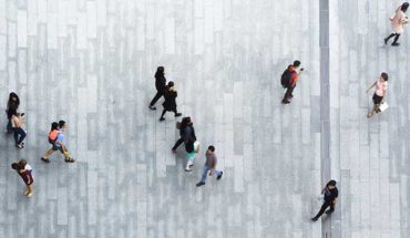 overhead view of people walking on sidewalk