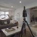 3-D camera device mounted on tripod in residential living room