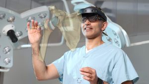 surgeon in operating room wears headset, gestures in mid-air