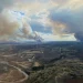 smoke billows from huge fires on horizon