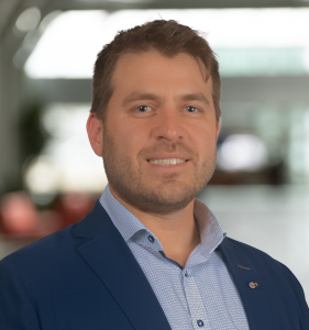 profile photo of smiling man in open shirt and jacket