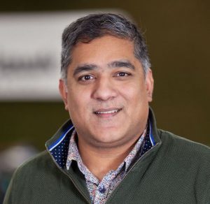 man smiles at camera