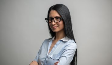woman wearing Mindlink eye tracking glassses