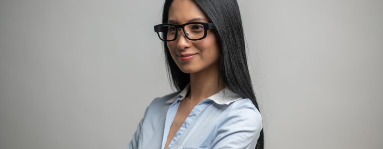 woman wearing Mindlink eye tracking glassses