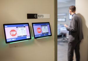 digital screens outside patient room