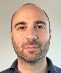 in close-up, man looks to camera