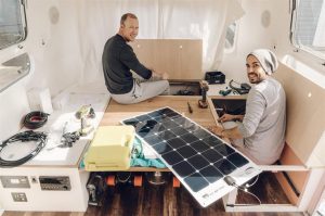 two men work on interior renovations